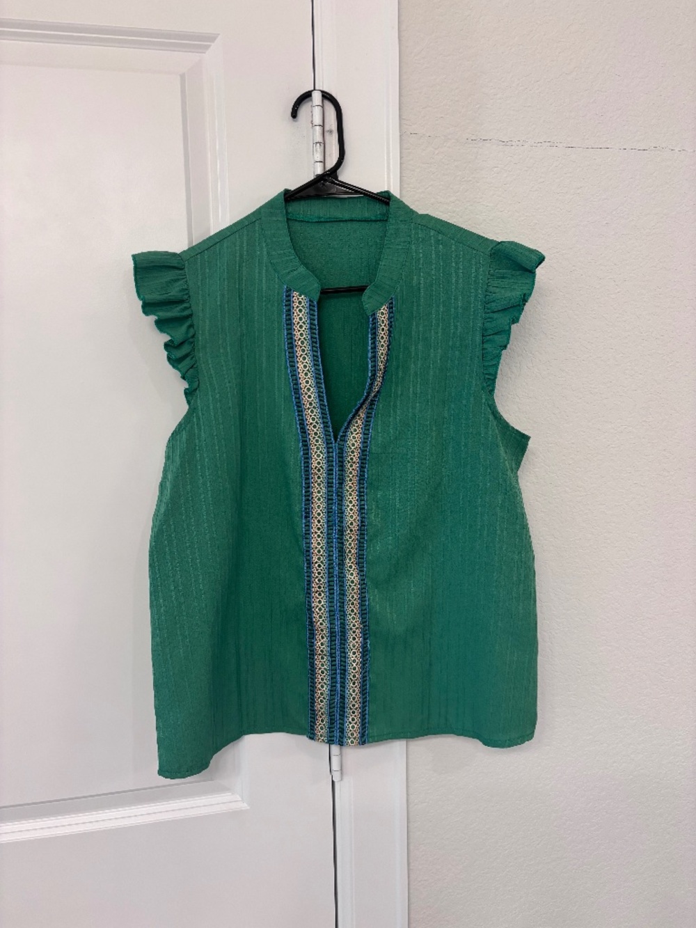 Green sleeveless shirt